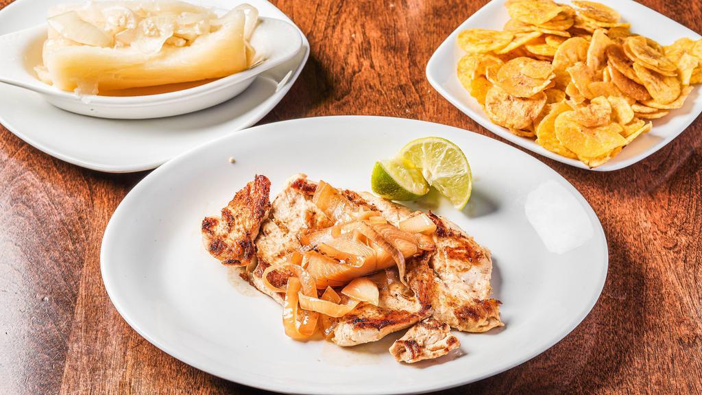 Bistec Pechuga De Pollo · Grilled chicken breast served with sautéed onions.