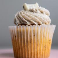 Cookies & Cream Cupcake · Vanilla/cookie cake topped with a buttercream Oreo blended icing.