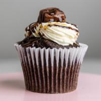 Snickers Cupcake · Chocolate cake topped with buttercream icing a mini snicker candy drizzled with caramel and ...