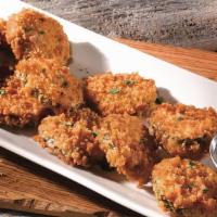 Fried Spicy Pickles  · Flash fried with beer batter and tossed in a zesty southern spice blend. Served with house-m...