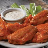 Bone-In Chicken Wings Tall · Traditional bone-in, twice cooked chicken wings hand tossed in one of our signature sauces o...