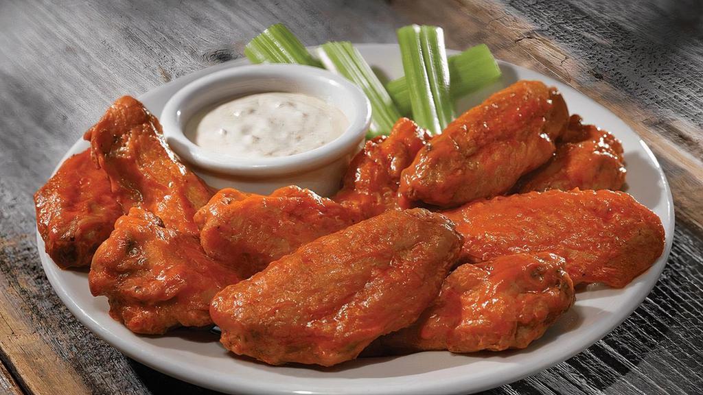Bone-In Chicken Wings Tall · Traditional bone-in, twice cooked chicken wings hand tossed in one of our signature sauces or dry rubs.