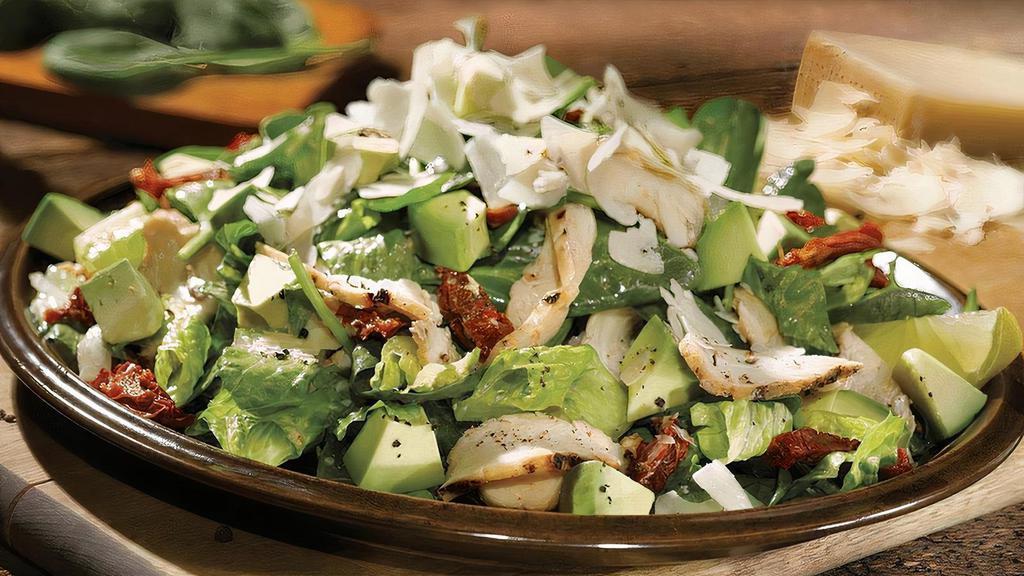 Spinach, Chicken & Avocado Salad · Applewood chicken with avocado slices on spinach and romaine, tossed with sun-dried tomatoes and finished with Parmesan and black pepper. Enjoy with lemon-vinaigrette dressing.
