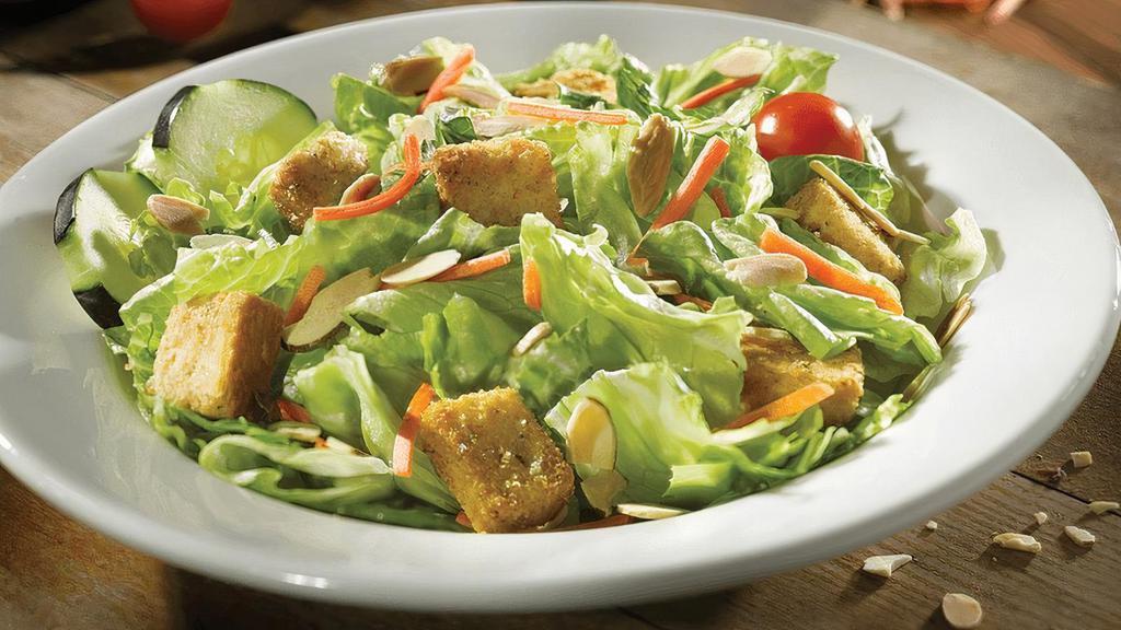 Side Garden Salad · Fresh greens, carrots, cucumbers, croutons, toasted almonds & grape tomatoes. Choice of dressing.