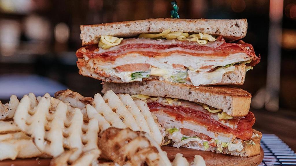Italian Melt · Sliced turkey, salami, pepperoni, mozzarella, on a toasted French roll with roasted garlic mayo, extra virgin olive oil, red wine vinegar, lettuce, tomatoes, & pepperoncini.