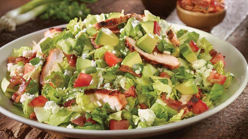 Old Chicago Chopped Salad · Applewood chicken, peppered bacon, bleu cheese, tomatoes and fresh green onions, topped with avocado & tomato. Enjoy with creamy herb dressing.