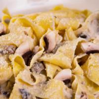 Pappardelle Ai Porcini · Al dente Pappardelle, with Mushrooms sautéed in Olive Oil,
Parmesan Cheese, Bechamel Sauce &...