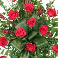 Crimson Departure Standing Spray · Send your loved one off with a truly classic standing spray filled with stunning red roses s...