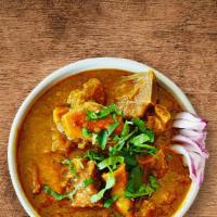 United Goat Curry · Tender goat meat cooked slowly  with tomatoes, onions, fresh herbs and Indian spices served ...