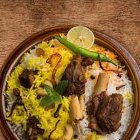United Lamb Biryani · Boneless lamb chunks cooked in a special biryani masala curry, layered with imported long gr...
