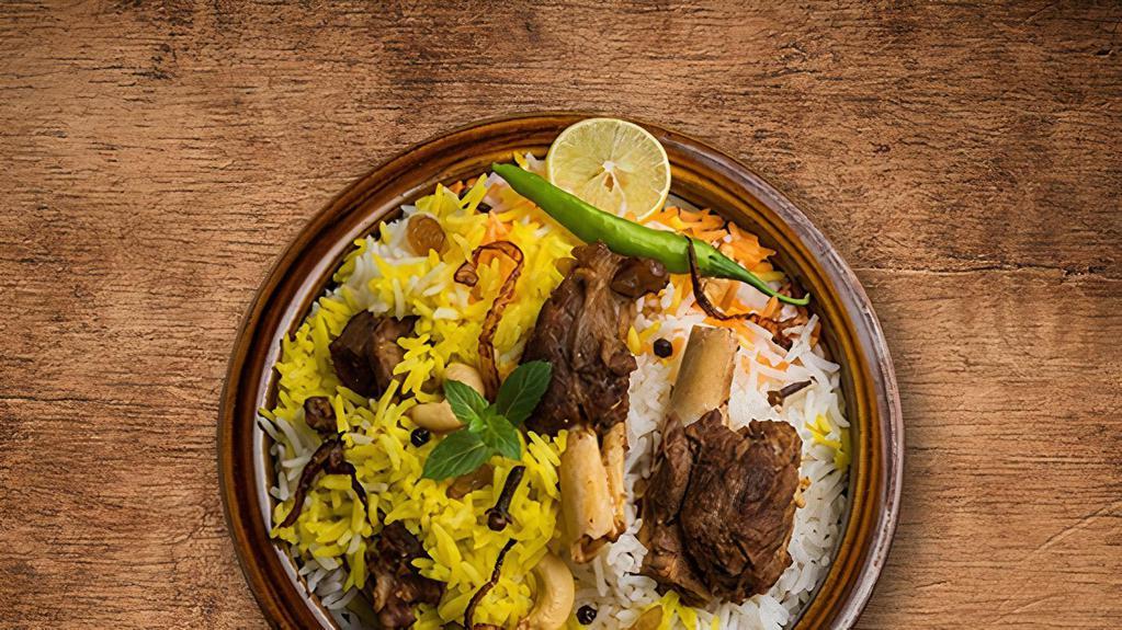 United Lamb Biryani · Boneless lamb chunks cooked in a special biryani masala curry, layered with imported long grain rice and steamed till cooked and smoked with coal served with a side of yogurt raita