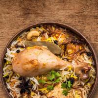 United Chicken Biryani · Tender morsels of chicken meat cooked with our signature biryani masala gravy and long grain...