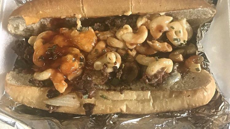 Philly Cheesesteak With 1 Side · Served on a hoagie bun with bell peppers, onions, mushrooms and cheese.