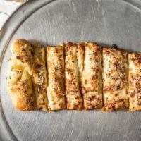 Stuffed Cheesy Bread · 6 Cheese Sticks loaded with mozzarella cheese inside and then topped with garlic butter, che...