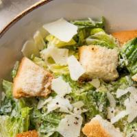 Caesar Salad · Romaine lettuce, bacon, croutons, shredded parmesan cheese, dressing.