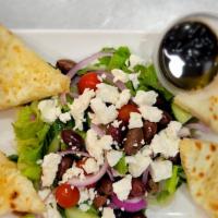 Greek Salad · Romaine lettuce, tomato, onion, feta cheese, cucumber, kalamata olive, dressing.