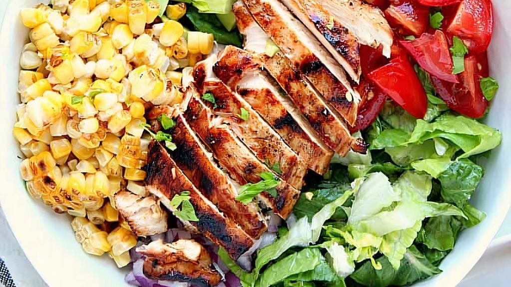 Chicken Salad · Romaine lettuce, marinated chicken, tomato, onion, cucumber, avocado, corn, cheese, pumpkin seeds.