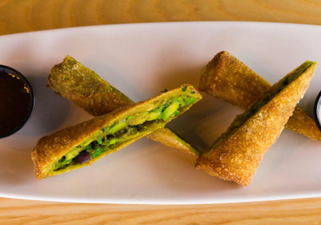 Avocado Cilantro Egg Rolls · Homemade and lightly fried to perFection and served with a Santa Fe ranch and sweet and spicy Thai sauce.