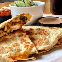 Garden Shrimp Quesadilla · Chili Lime Shrimp, Roasted Corn Salsa, Jalapenos and Mexican Cheeses. Served with Chipotle S...