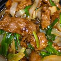 Mongolian Beef · Served with stir fried bell pepper, onion, scallion, carrot, celery & shoots.
