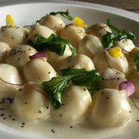 Gnocchi Asiago · Homemade potato gnocchi, stuffed with Asiago
cheese, served in a four-cheese sauce, with cri...