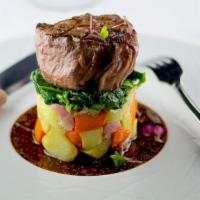 Filet Mignon · Served over tri-color potatoes, sautéed spinach and
blue cheese sauce

Consuming raw or unde...