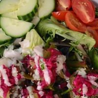 Falafel Salad · Lettuce, tomato, onion, cucumber, pickles, turnips, falafel patties with tahini sauce, and h...