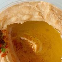 Harissa Hummus · Chickpeas,  harissa peppers, tahini sauce, garlic, and fresh lemon juice. Served with pita b...