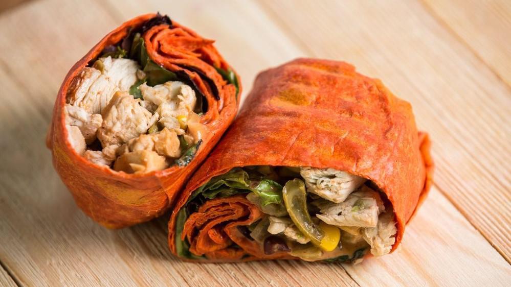 Southwest Turkey Wrap · Sundried tomato wrap, natural turkey breast, bean mix, and spicy chipotle sauce.
