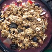 Acai Bowl · Brazilian acai, banana, strawberries, blueberries, organic granola, honey and coconut flakes.