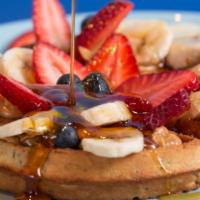 Belgium Chia Waffle · Belgium chia waffle, with bananas, strawberries, blueberries, a side of peanut butter and ho...