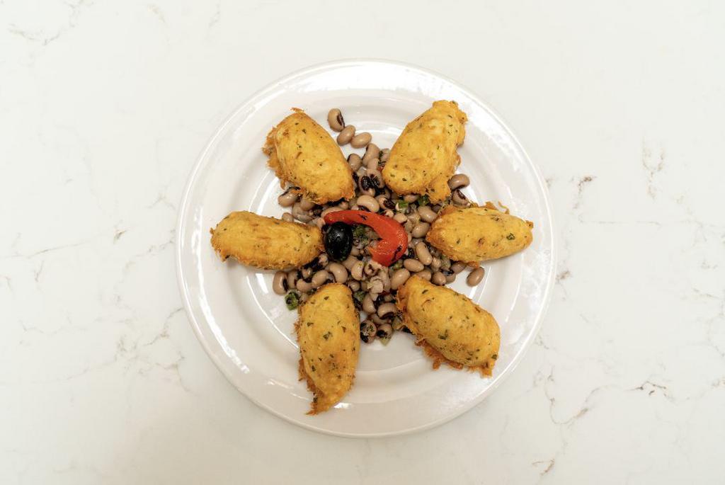Bolinhos De Bacalhau · Codfish Croquettes served with Black Eyed Peas