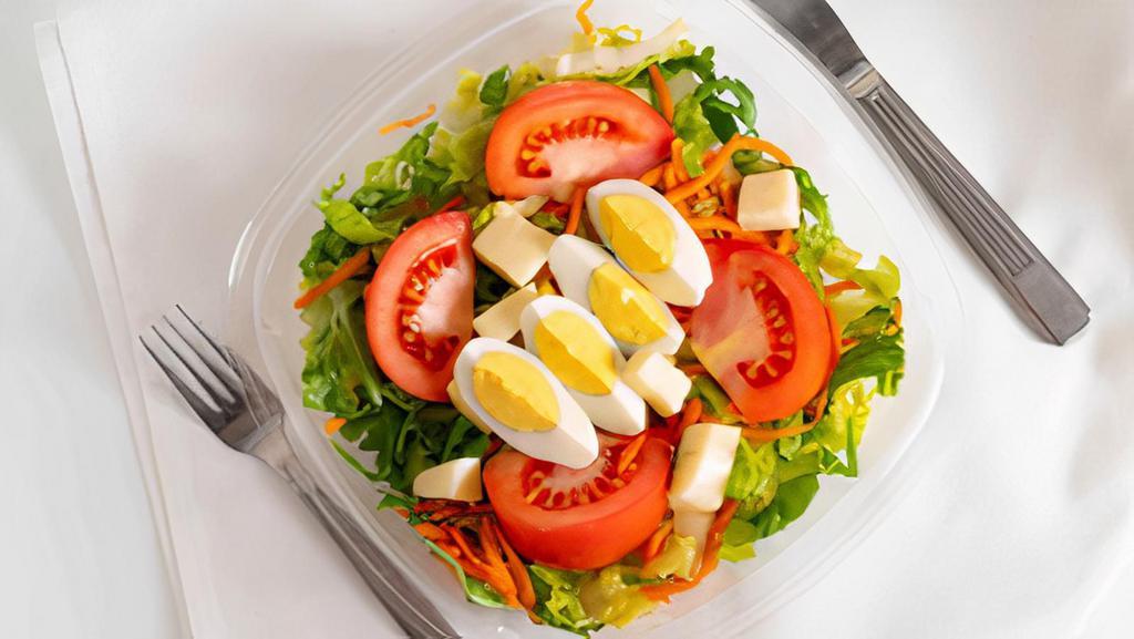 Salada Portuguesa · Traditional Portugues Salad, Lettuce, Tomatoes, Carrots, Cheese, Parsley and Slices of boiled Egg