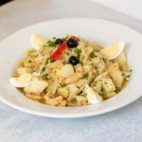 Bacalhau À Gomes Sá · Shredded Cod mixed with steamed Potatoes, Onions, boiled Egg Slices, Garlic, and Olive Oil
