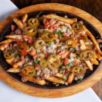 Fiesta Fries · A bed of fries topped with ground beef, pico de gallo, jalapeños and cheese dip.