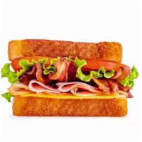 Jefferson’S Club · Sliced ham and turkey, with American cheese, lettuce, tomato and applewood smoked bacon serv...