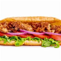 Oyster Po’Boy · Fresh fried oysters served on a hearth baked hoagie bun with lettuce, tomato, onion and cock...