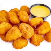 Corn Nuggets · Lightly battered served with honey mustard.