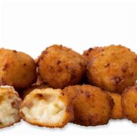 Jalapeño Cheese Bites · Jalapeno mac 'n' cheese fried golden and served with our jalapeno sauce