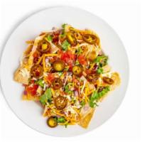 Nachos Supreme · A mountain of fresh tortilla chips smothered in chili and queso cheese, topped with lettuce,...