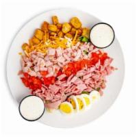Chef Salad · Our house salad topped with ham, turkey and egg.