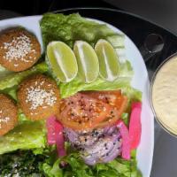 Vegan Platter · Tabbule, hummus, 4 falafel, mix salad, 1 Pita bread & hummus.