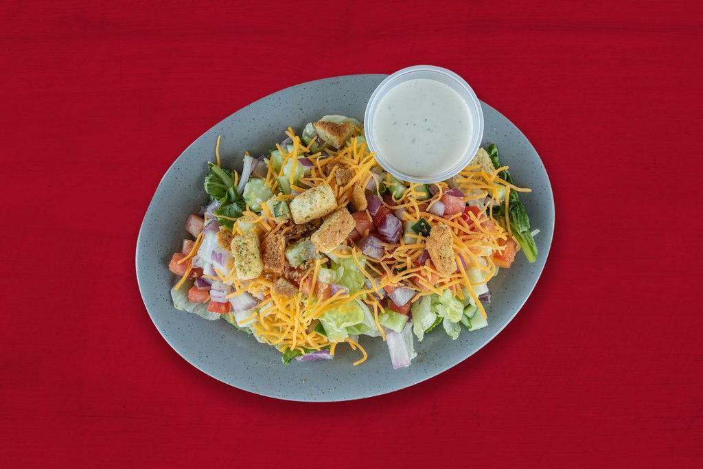 Side Salad · Mixed greens, diced cucumbers, red onion, and tomatoes, topped with croutons, shredded cheddar cheese and choice of dressing.