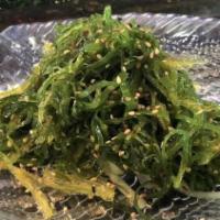 Seaweed Salad · Salad with a salty seasoned microalgae base. extras are for an additional charge.