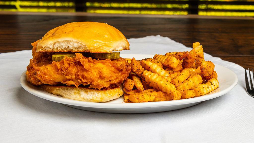 Chicken Sandwich · Crispy fried chicken breast on a brioche bun with tangy sweet Hamilton sauce and pickles, served with seasoned French fries or mashed potatoes with gravy.