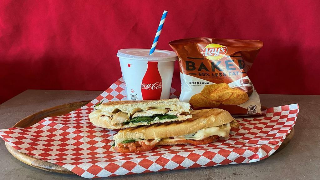 Chicken Breast Panini · Whole Chicken breast. Swiss cheese, tomatoes, spinach, mayo-pesto house-made spread, salt, black pepper, extra virgin olive oil, and balsamic vinegar.