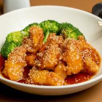 Sesame Chicken · Breaded chicken glazed with sweet sauce, sesame seeds and steamed broccoli