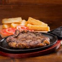 Churrasco · Churrasco grill steak, with your choice of one side, one slice of tomato and chimichurri.