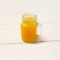 Turmeric Shot · Fresh Turmeric With Lime, Apple, Black Pepper, And a Wedge Of Pineapple