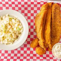 Fish And Chips · Three pieces of fresh beer battered tilapia, two hush puppies, a side of potato salad, serve...